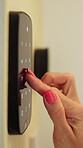 Typing, hands and smart lock in house, safety and password for keyless entry in apartment and online. Digital, access and person with electric keypad, security system and code to unlock door in home