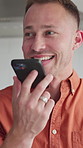 Man, laughing and home with phone for chat, loudspeaker and communication with contact or discussion .Happy, person and talking with mobile on weekend, humor and funny conversation with technology