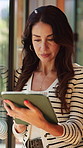 Window, typing and woman on tablet for remote work with online article, copywriting and research. Home, wfh and mature person on digital tech for freelance writer with review, story pitch or feedback