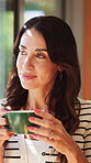 Thinking, window and happy woman with drink in home for inspiration, reflection and relax in morning. House, view and person with tea for calm, peace or wellness for daydreaming, thoughtful and rest