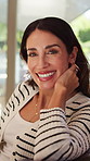 Face, laughing and woman on break in house, happiness or chilling on peaceful holiday in living room. Mature person, smile and humor on weekend, calm and comfortable on sofa and resting in home