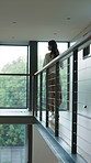 Walking, coffee and woman in home office for remote work with freelance corporate career. Cappuccino, balcony and female financial manager by desk with warm beverage in morning for investment project