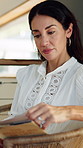 Woman, reading book and relax in living room with story, literature and poetry for language in home. Mature person, information and knowledge with novel, fiction and learning in lounge at apartment