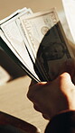 Counting, bills and dollar with cash and hands for money laundering, crime and bribery payout. Interest rate, corruption and cashback fraud with person for profit, settlement deal and scam notes