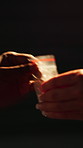 Hands, drugs and cash for deal in night, street or alley with plastic package for narcotic substance. Person, addiction and white powder with money, illegal transaction and crime with opiod crisis