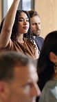 Woman, conference or hands raised with question in crowd for presentation workshop in office. Female person, employee or engagement with team inclusion, group or participation in seminar for answer