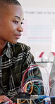 Boys, robotics and classroom in school for students, discussion or future development. People, wiring and education with electronics, transportation or machine for knowledge or engineering project
