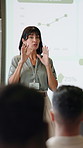 Woman, presentation and crowd at seminar with discussion, graphs and screen for market share growth. Person, speaker and whiteboard with insight, explain and charts with conference at finance agency