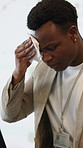 Laptop, speaker and anxiety with sweating in seminar for speech, notes preparation and pressure. Tech, black man and stress at keynote address for public speaking, conference presenter and nervous
