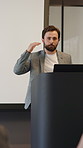 Business, man and presentation with speech in office for discussion, training and finance event. Male person, presenter or public speaking for coaching, upskill development and investment opportunity