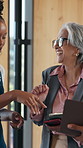 Conference, networking or women on break with tablet, discussion or business advice at workshop. Collaboration, meeting or employees with tech, b2b opportunity or guidance at corporate seminar.