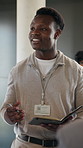 Businessman, talk and networking at convention center with notebook, seminar and trade show agenda. Person, conversation and diary in conference event with expo schedule, advice and writing notes.