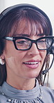 Call center, glasses and woman in agency with headset, contact us or outbound sales in online communication. Telemarketing, mic and mature agent with specs, lead generation or outreach in crm service