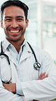 Happy man, face and doctor with confidence in hospital for medical service at health center. Portrait, male person or healthcare worker with smile or arms crossed for cardiology or clinic support