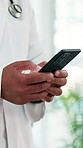 Phone, hands and doctor in hospital with telehealth, texting and email for medical feedback. Technology, person and male healthcare worker on cellphone for online consultation on mobile app in clinic