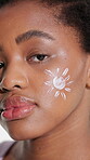 Face, skincare and girl with sunscreen in studio for UV protection, healthy skin and benefits. Natural, black person and SPF lotion on white background for beauty routine, moisturizer and self care