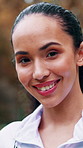 Face, fitness and smile of woman outdoor in nature for commitment to training or workout. Cardio, exercise and routine with happy runner in park for dedication, improvement or wellness activity