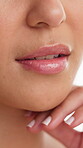 Cosmetics, beauty or lips of woman in studio for dermal filler, synthetic hyaluronic acid or results. Dermatology, person and mouth closeup on white background with HA treatment, lipgloss and volume