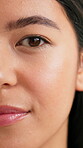 Serious, beauty and half face of woman in studio for skincare, self care and dermatology glow. Aesthetic, shine and facial hydration with person on white background for grooming, hygiene and clean