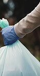 Volunteer, hands and garbage bag outdoor for trash collection, recycling project or waste management. Eco friendly, charity and person cleaning with plastic for rubbish, sustainability or NGO service