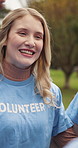 Happy woman, volunteer or discussion with team or huddle for community service or outreach in park. Female person, NGO or talking with group in circle for charity, outdoor mission or humanitarian aid