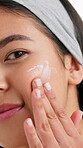 Sunscreen, cream and face of woman in studio for skincare, lotion self care and dermatology glow. Aesthetic, shine and spf protection with female person on white background for uv, beauty and clean