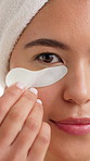 Beauty, face and eye patch with woman in studio for skincare, self care and aesthetic. Dermatology, glow treatment and shine with female person on white background for cosmetics and hydration