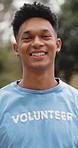 Happy man, face and nature with volunteer for community service, charity or outdoor outreach. Portrait, male person or NGO with smile for social responsibility, support or humanitarian aid in park