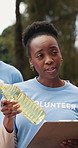 Woman, volunteer and groceries with clipboard outdoor for food drive, donation inventory and ngo event. Person, talk  and checklist for resources, social responsibility and planning for distribution