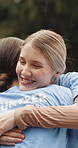Women, hug and volunteers with smile in nature, greeting or solidarity for community service at park. Friends, embrace and gratitude for help, team and happy people with social responsibility for NGO