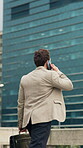 Back, businessman and commute in city with phone call, walk and feedback for real estate negotiation. Realtor, person and outdoor downtown with tech, contact and journey for property listing update.