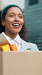 Woman, box and happy in city for new job with walk, inspiration and excited for fresh start. Business person, package and smile with reflection, thinking and books for career growth in urban town