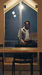 Business, black man and laptop in office pod for research, email client and real estate at night. Thinking, male realtor and pc in cubicle, pricing property and online inquiry for listing deadline
