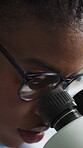 Microscope, glasses and science with black woman in laboratory for research, disease cure and dna. Medical sample, microbiology review and vaccine trial with person in clinic for healthcare study