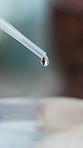 Person, petri dish and pipette with liquid drops for biology, examination or experiment in lab. Closeup, scientist and medical research with molecule for healthcare cure, discovery or clinical trial