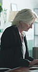 Typing, business and woman with laptop in office, claim investigation and research for evaluation. Review, audit or mature insurance broker with computer for incident report, risk assessment or glass