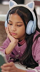 Streaming, headphones or kid on floor with tablet, movie binge or cartoon watching on digital app. Relax, multimedia or girl in home with tech, child series or subscription on entertainment platform
