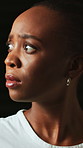 Scared, black woman and worry with anxiety in studio from trauma, stress and mental health. Motion blur, person and nervous with nail biting, psychological ptsd and fear reaction on dark background