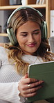Happy, tablet and woman with headphones on sofa for online videos, movie app and streaming. Relax, apartment and person on digital tech for internet, subscription and connection for watching series
