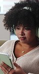 Typing, tablet and black woman with headphones on sofa for online videos, social media and streaming. Relax, home and person on digital tech for internet, website and connection to listen to podcast