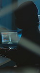 Person, hacker and typing with computer at night to bypass security, cyberattack and ransomware. Criminal, hoodie and hacking pc for system access, data breach and programming with coding encryption