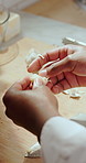 Chef, hands or meal prep with garlic clove on chopping board in kitchen for catering or hospitality. Person, ingredients and getting ready with recipe for cooking food, cuisine or dinner service