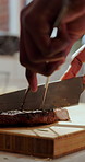 Hands, knife and steak with chef in kitchen for culinary dish, prepare and gourmet meal. Cuisine, protein and slice with person cutting beef or meat for cooking, diet and nutrition in restaurant