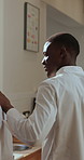 Chef, help and man in kitchen, talking and support for meal prep, culinary skills or menu. People, employees or coworking in restaurant, discussion for recipe or collaboration for hospitality service