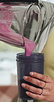 Smoothie, pouring and hands of woman in kitchen for protein shake, wellness and nutrition. Vitamins, gut health and breakfast beverage with person in home for diet drink, supplements and blender