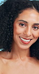 Skincare, happy and face of woman in studio with natural beauty, cosmetics or facial glow. Confident, smile and portrait of female person with dermatology for wellness by blue background in Colombia.
