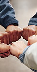 People, hands and huddle with fist bump in warehouse for teamwork, solidarity or support together. Group, employees or inclusion with agreement for distribution mission, synergy or unity in depot
