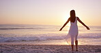 Space, sunset and freedom with woman at beach for summer vacation, tropical island and seaside. Holiday getaway, weekend break and peace with back of person outdoor for wellness, travel and paradise