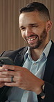 Laughing, phone and text message with business man in office for break, communication or response. App, social media and typing with funny employee in workplace lobby for mobile or online chatting