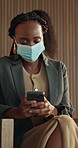 Businesswoman, mask and texting with phone in airport and protection from covid, thinking or online. Business travel, waiting room and person with mobile for communication, safety or virus prevention